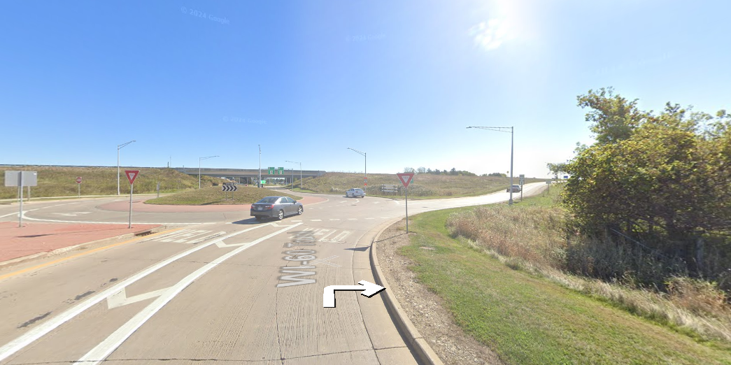 At the traffic circle, continue straight to stay on WI-60 Trunk E